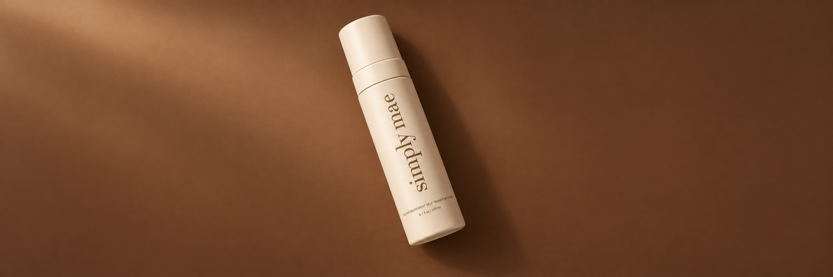 Simply Mae mousse bottle on a warm brown background